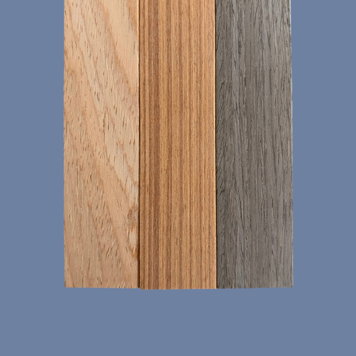 Three wooden planks with different finishes on a blue background
